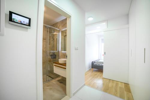 Postel nebo postele na pokoji v ubytování Sun Square Apartments