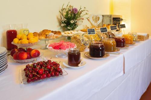 a table with fruit and other food on it at Podere Belvedere in Barberino di Mugello