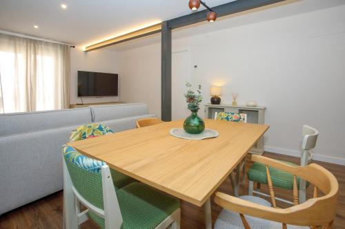 a living room with a table and a couch at -La Olmeda- La Casona del Zoilo in El Burgo de Osma