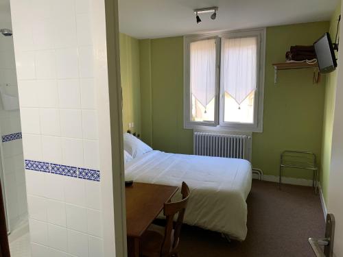Кровать или кровати в номере La Locomotive