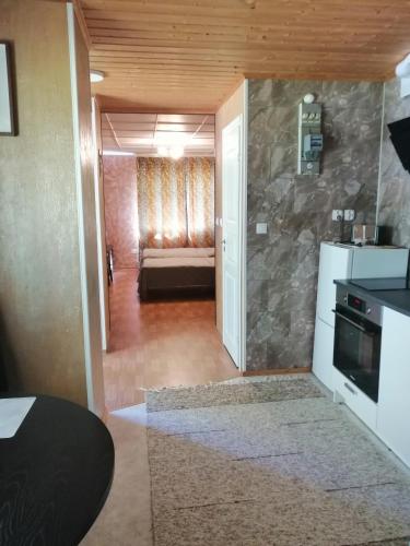 a living room with a couch in a room at Apartment by the park in Imatra
