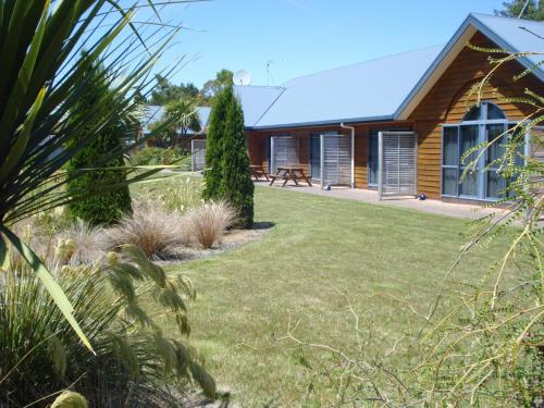 a house with a yard in front of it at The Peaks Motor Inn in Ohakune