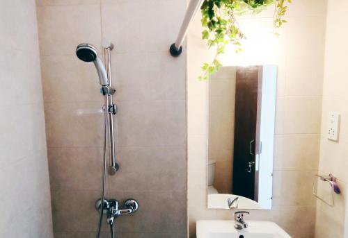 a shower in a bathroom with a sink and a mirror at Mediterranean Seaside Authentic Beach House in Polis Chrysochous