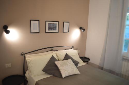 a bedroom with a bed with two pillows on it at Casa Jumasca in Massa Lubrense