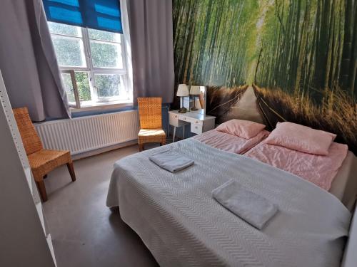 Postel nebo postele na pokoji v ubytování Kotkan Residenssi Apartments