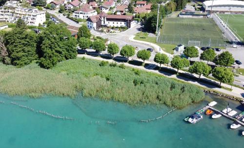 an aerial view of a river with boats in the water at Hôtel Les Muses in Annecy