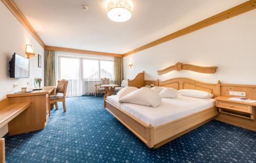 Postel nebo postele na pokoji v ubytování Hotel Moserhof