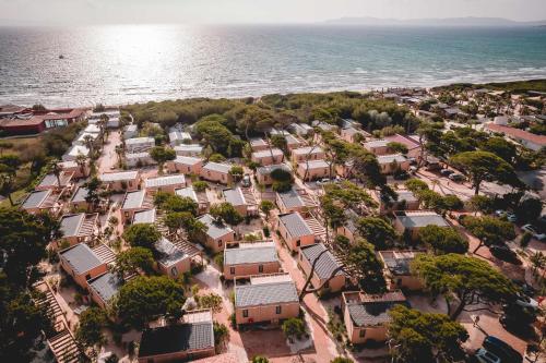 an aerial view of a village next to the ocean at Salines in Hyères