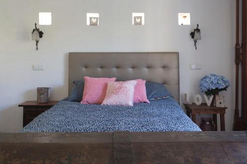 A bed or beds in a room at Casa De Mondo