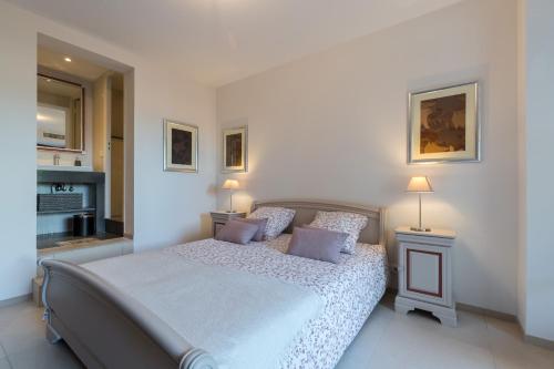 Ένα ή περισσότερα κρεβάτια σε δωμάτιο στο Villa sur les hauteurs de Nice, proche centre