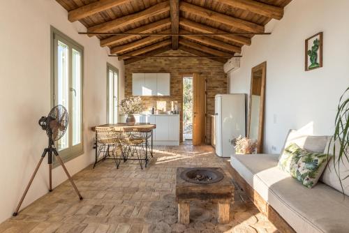 a living room with a couch and a table at Rizes Sea View in Nisakion