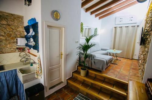 a room with a stairway leading to a living room at Casita del Castillo in Denia