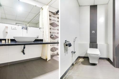 a bathroom with a sink and a toilet at Sapphero Resorts in Shirdi