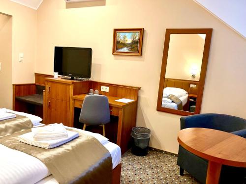 Letto o letti in una camera di Borostyán Panzió