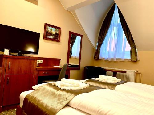 Letto o letti in una camera di Borostyán Panzió