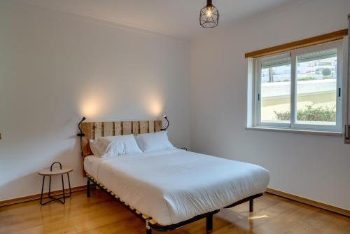 Ένα ή περισσότερα κρεβάτια σε δωμάτιο στο Ericeira Sea View