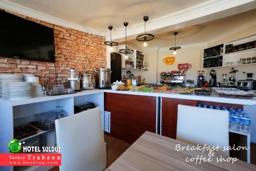 a kitchen with a counter and a counter top at Sulduz Hotel in Trabzon