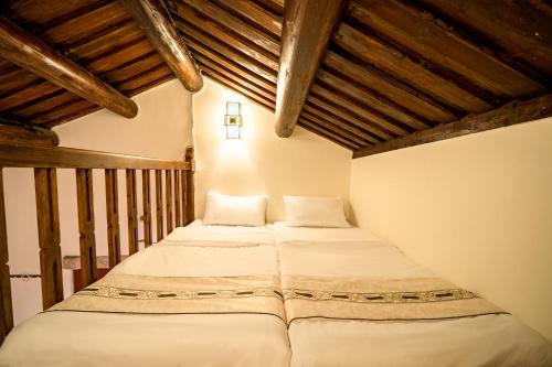 מיטה או מיטות בחדר ב-Kinmenhouse of Old Tiles No 4