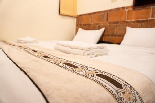Cama o camas de una habitación en Kinmenhouse of Old Tiles No 4