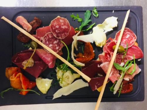 a plastic tray of food with chopsticks on it at Au Père Tranquille in Tinchebray