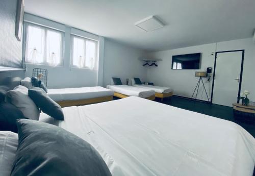 a person taking a picture of a room at Hotel Air-lane in Saint-Léger-sous-Brienne