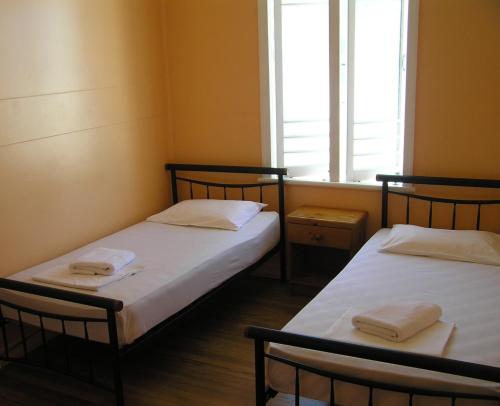 Postel nebo postele na pokoji v ubytování Civic Guest House