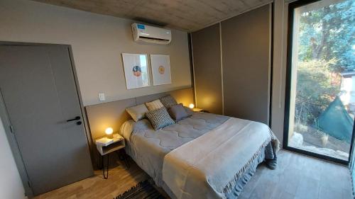 Una cama o camas en una habitación de LUNALBA
