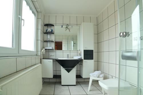 Kuchyň nebo kuchyňský kout v ubytování Hotel Zrenners GARNI