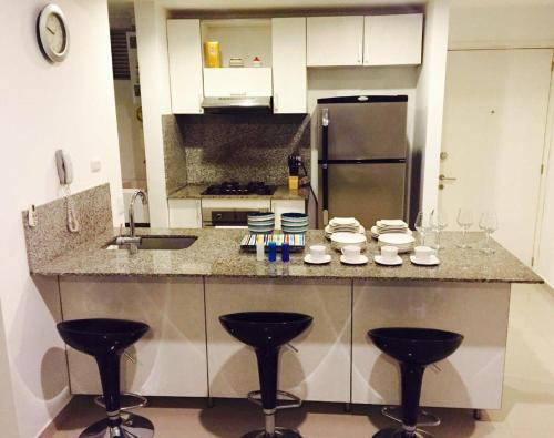 Kuchyň nebo kuchyňský kout v ubytování MORROS ULTRA APTO 706