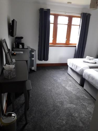Кровать или кровати в номере Victoria House Bed and Breakfast