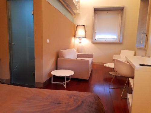 Ein Sitzbereich in der Unterkunft Hotel Ceres