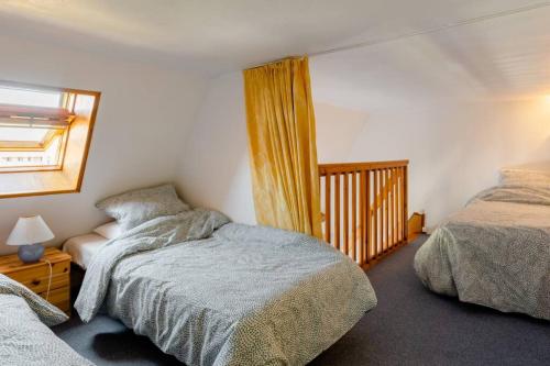 Un ou plusieurs lits dans un hébergement de l'établissement Duplex by the sea in Normandy