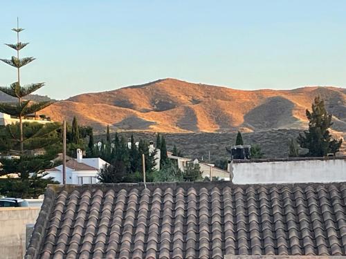 a view of the mountains from a roof at Casa Olivia villa in Arboleas