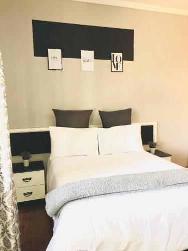 Postel nebo postele na pokoji v ubytování VnA Guesthouse