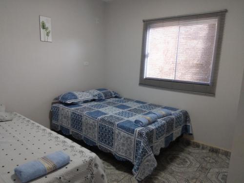 Ένα ή περισσότερα κρεβάτια σε δωμάτιο στο CASA TEMPORADA - PARA 05 PESSOAS