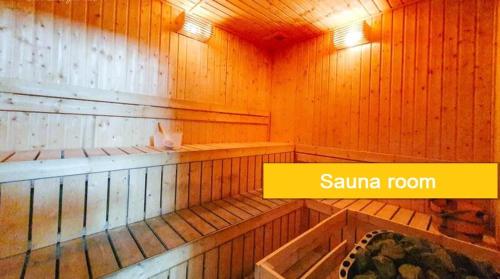 a sauna room with wooden walls and a sign that says sauna room at ABHOME "JAPAN SUITE" #GreenHaven #Olympic Pool #360"SeaView #JB in Johor Bahru