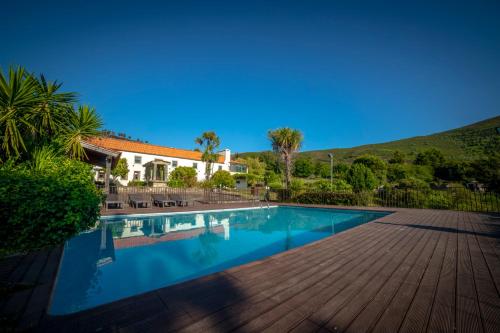 a swimming pool in front of a house at Convento San Payo in Vila Nova de Cerveira