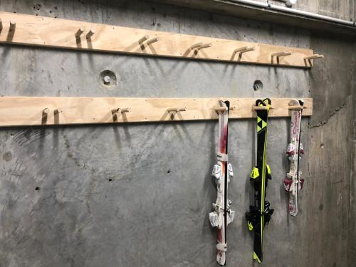two pairs of skis are hanging on a wall at La Quinta by Wyndham Remarkables Park Queenstown in Queenstown
