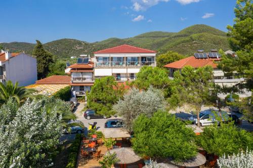 an aerial view of a resort with mountains in the background at Sunset Studios in Toroni