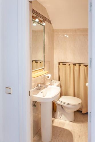 a bathroom with a sink and a toilet at 13 - EL DUPLEX de la ALAMEDA - ENJOY TARIFA in Tarifa