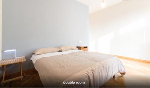 En eller flere senge i et værelse på B&B Quadrifoglio
