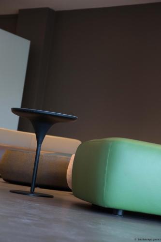 a table with a green object on top at Point Hotel in Piove di Sacco