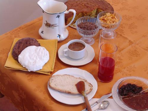 a table with a plate of bread and other food at Hotel Roma in Scanno