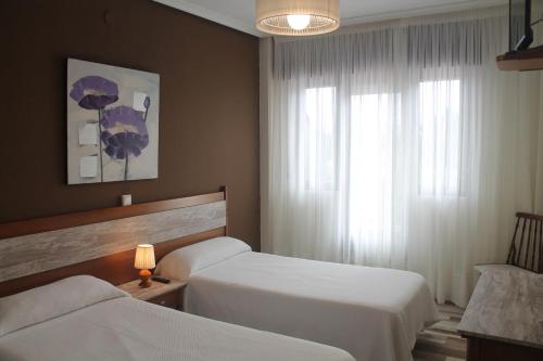 Кровать или кровати в номере La Flor de Quejo