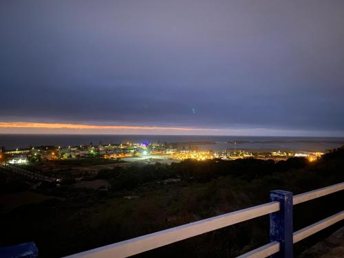 a view of a city at night with lights at LES OLIVIERS Villa N1 avec piscine privée in Oualidia