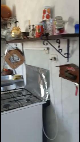 a kitchen with a stove and a counter top at Cozy sunny ground chalet with terrace-Ras Sudr in Ras Sedr
