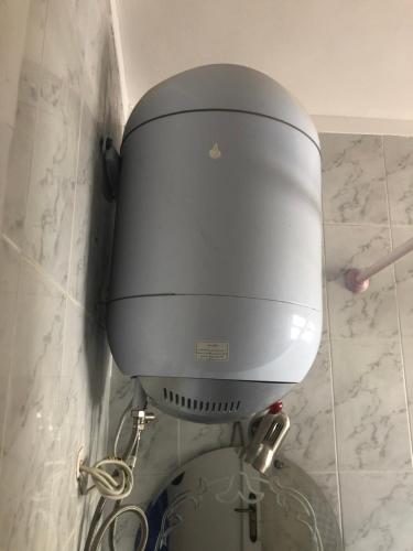 a toilet in the corner of a bathroom at Cozy sunny ground chalet with terrace-Ras Sudr in Ras Sedr
