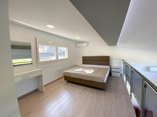 A bed or beds in a room at IL-Holidays Paralia