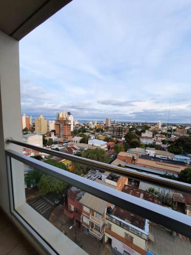 a view of a city from a window at Monoambiente céntrico in Posadas