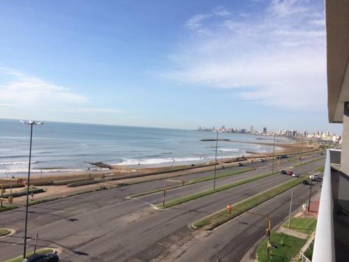 a view of the beach and the ocean from a building at Departamentos Eneas Frente al Mar in Mar del Plata